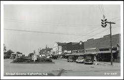 Downtown Street with Businesses and Cars Postcard