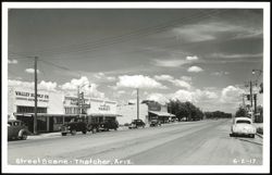 Street Scene with Valley Supply, Pharmacy, Market, and Cars Postcard