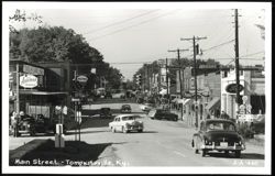 Main Street with Businesses and Cars Postcard