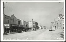 Main Street with Businesses and Vintage Cars - Sanderson, TX Postcard