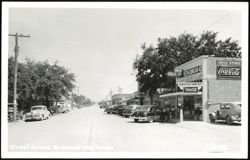Street Scene with Nipper Drug Co. and Vintage Cars Postcard