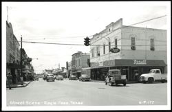 Street Scene with Rexall Drug Co. and Vintage Cars Postcard