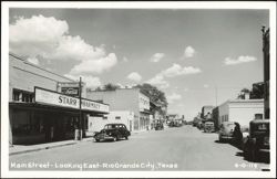 Main Street Looking East with Starr Pharmacy and Vintage Cars Postcard