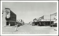 Downtown Street Scene with Starr Pharmacy and R. Hinojosa y Hnos Building Postcard