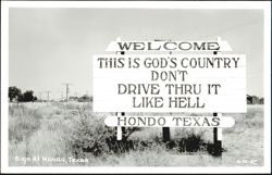 Welcome Sign, 'This is God's Country Don't Drive Thru It Like Hell' Postcard