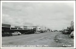 Commercial Street, Aransas Pass, TX - Businesses and Parked Cars Postcard