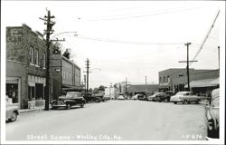 Whitley City, KY Main Street with Vintage Cars and Businesses Postcard