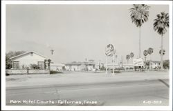 Park Hotel Courts with multiple signs and palm trees Postcard