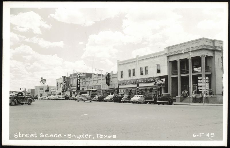 Downtown Street View with Businesses, Cars, and Pedestrians Snyder Texas