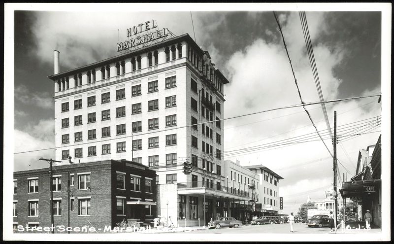 Hotel Marshall and Street Scene with Cars and Pedestrians Texas