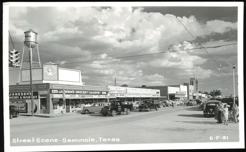 Street Scene with Jameson's Grocery, Water Tower, and Tower Theater Seminole Texas