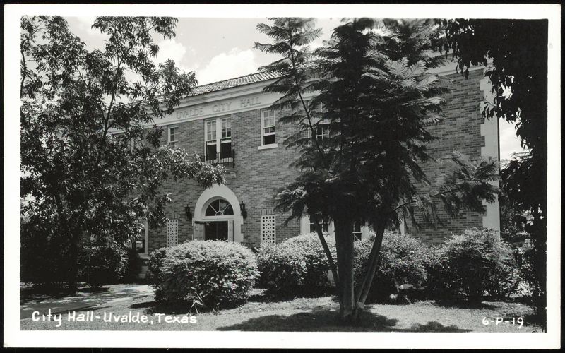Uvalde City Hall building with trees and landscaping Texas