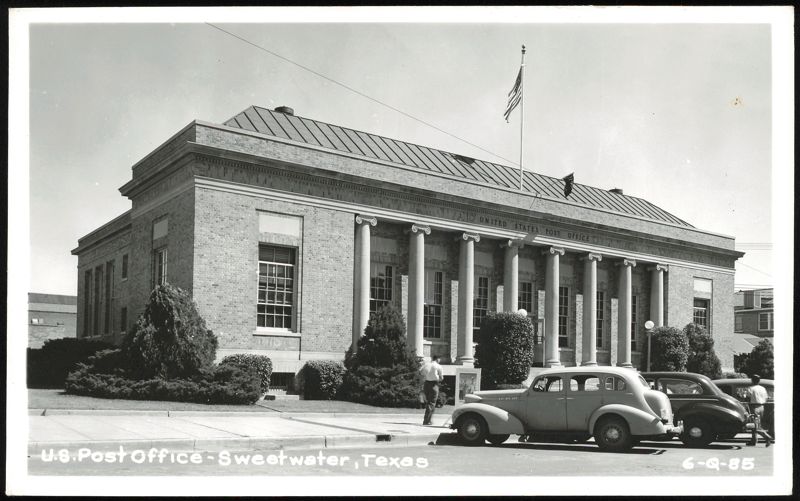 U.S. Post Office building with Ionic columns, cars, and people Sweetwater Texas