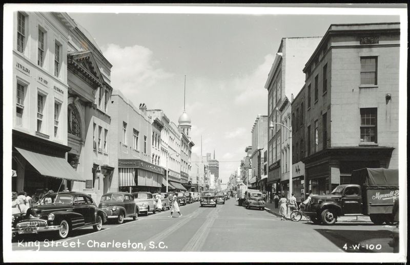 King Street, Charleston, S.C. with stores and vintage cars