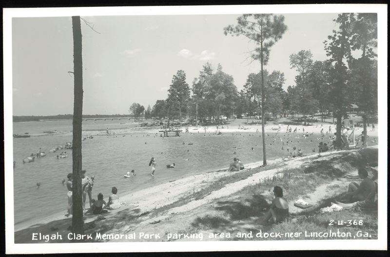Eligah Clark Memorial Park, parking area and dock with swimmers Lincolnton Georgia