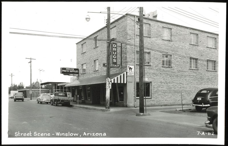Street Scene with Drugs and Photo Supplies Stores, Winslow Arizona