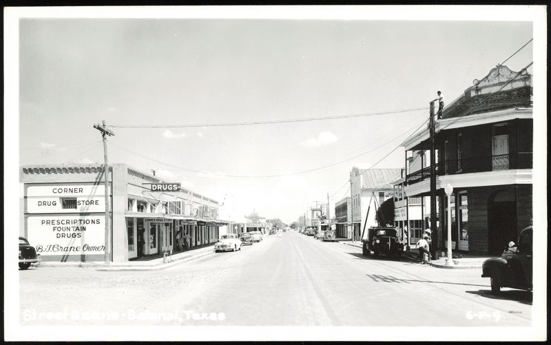 Main Street View with Corner Drug Store and Businesses Sabinal Texas