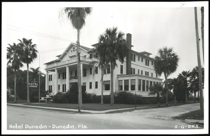 Hotel Dunedin, large white building with columns and palm trees Florida