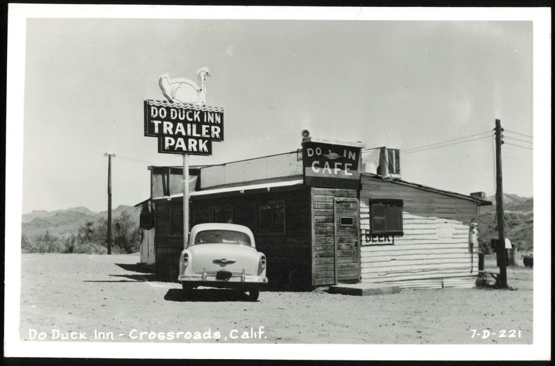 Do Duck Inn Trailer Park & Cafe with parked car Crossroads California