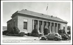 U.S. Post Office building with Ionic columns, cars, and people Postcard