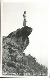 Woman standing on The Blowing Rock Postcard