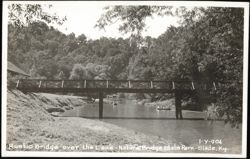 Rustic Bridge over the Lake - Natural Bridge State Park Postcard