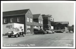 Street Scene with London's Service Station, City Cafe, and Sequatchie County Herald Postcard