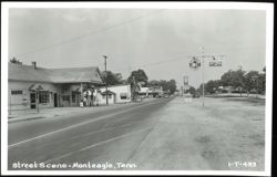 Street Scene with Cafes, Gas Station, and Hotel Postcard