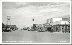 Street Scene with Majestic Theater, Taylor Wright Drug, and Water Tower Postcard