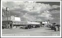 Street Scene with Jameson's Grocery, Water Tower, and Tower Theater Postcard
