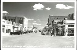 Avenue D Looking East, Street Scene with Businesses and Vintage Cars Postcard
