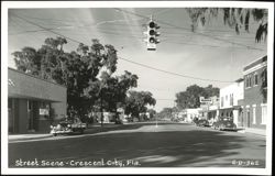 Street Scene with Peoples Bank, Western Union, and Classic Cars - Crescent City Postcard