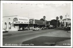 Downtown Street Scene with Rexall Drug Store, Cafe Louie's, and Courthouse Postcard