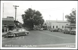 Street Scene with Vintage Cars and Businesses Postcard