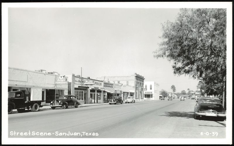 Street Scene with Eddy's Steakhouse and Local Businesses