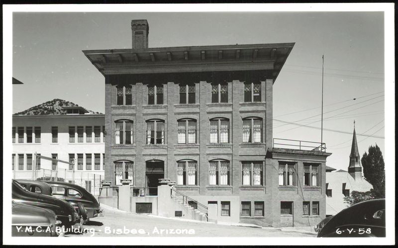 YMCA Building with Cars and Church Spire Bisbee Arizona