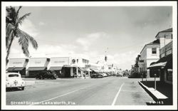 Street Scene with Rexall Drugs and Men's Wear Postcard