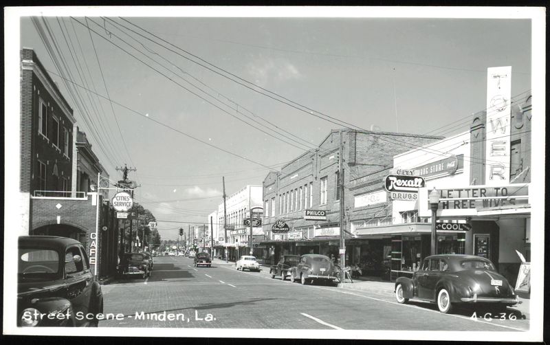 Street Scene with Tower Theatre and Rexall Drug Store Minden Louisiana