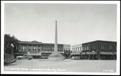 Town Square Monument and Businesses in Lawrenceburg Postcard