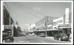 Street Scene with Tower Theatre and Rexall Drug Store Postcard