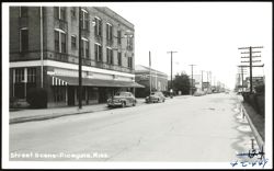 Ford Hotel and Cafe on Main Street Postcard