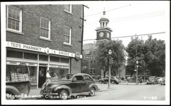 Ted's Pharmacy and Courthouse Clock Tower Postcard