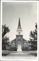 Baptist Church Exterior with Tall Steeple Postcard