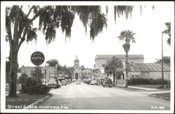 Street Scene with Courthouse and Orange Hotel Sign Postcard