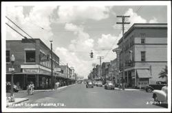 Downtown Lemon Street Scene with Stores and Cars Postcard