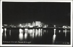 Skyline Across the Water at Night Postcard