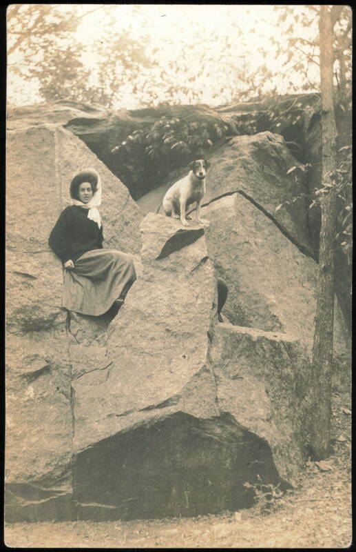 Woman and Dog Sitting on Large Rock Formation Morgan Minnesota