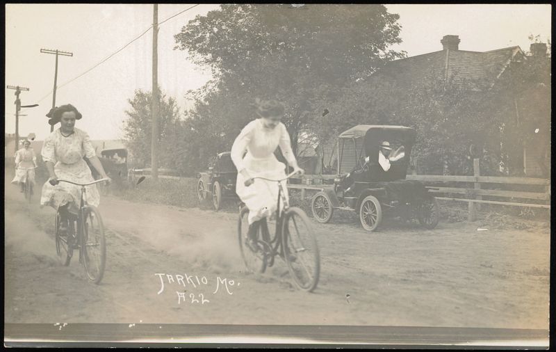 Women Riding Bicycles on Dirt Road in Tarkio, Missouri