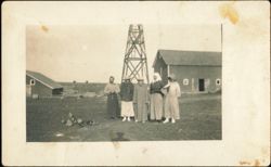 Five Women Standing in Front of Farm Buildings and Windmill Postcard
