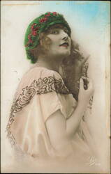 Art Deco Portrait of a Woman Wearing a Green Hat with Red Flowers Postcard